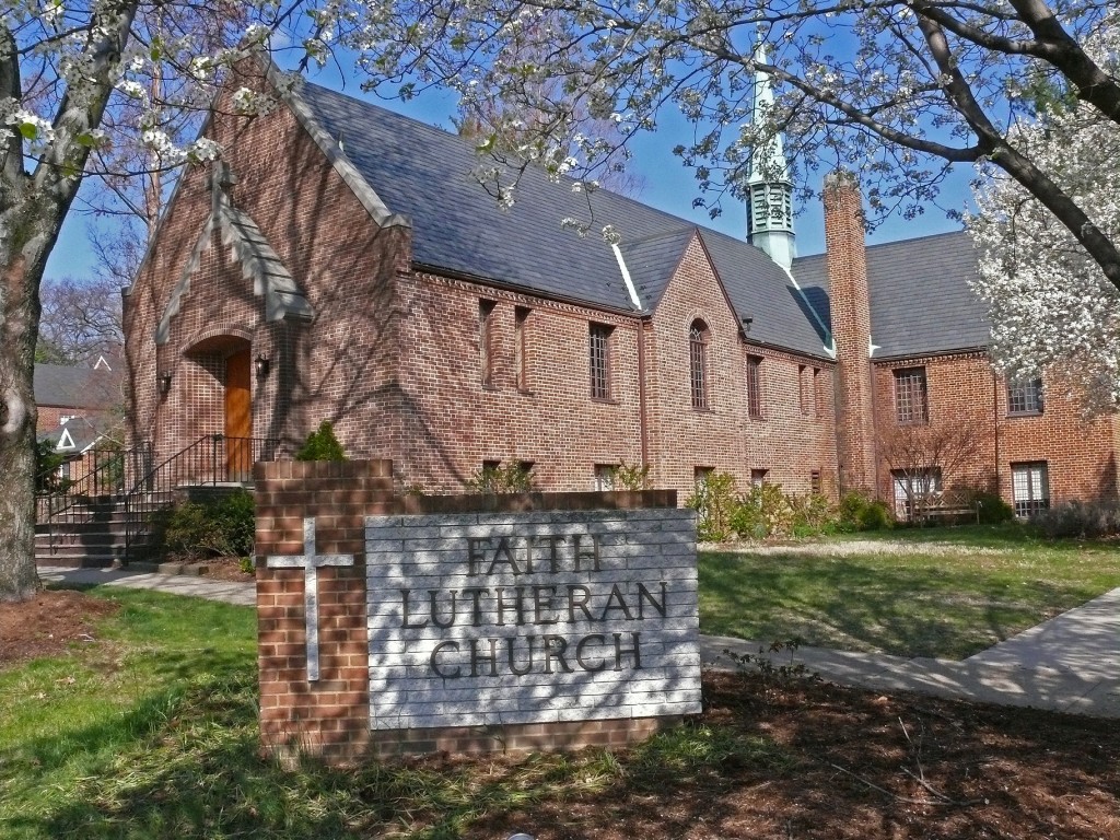 A large brick church with a steeple